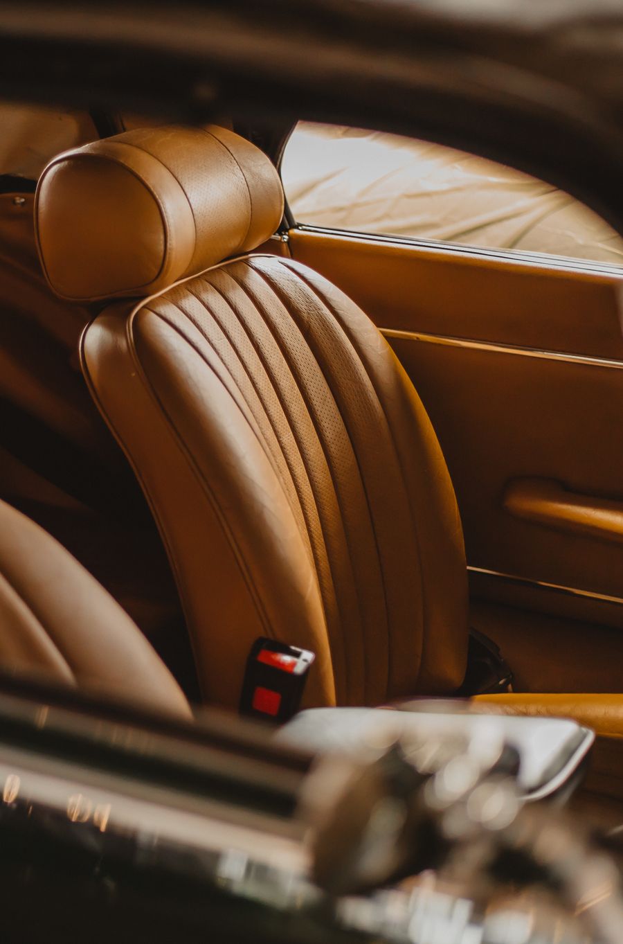Tan foam-backed leather car seat upholstery